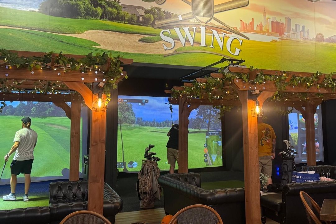 Golf simulator lounge with pergola seating at SWING Middletown